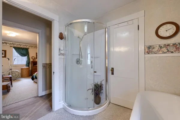 a bathroom with a tub and shower