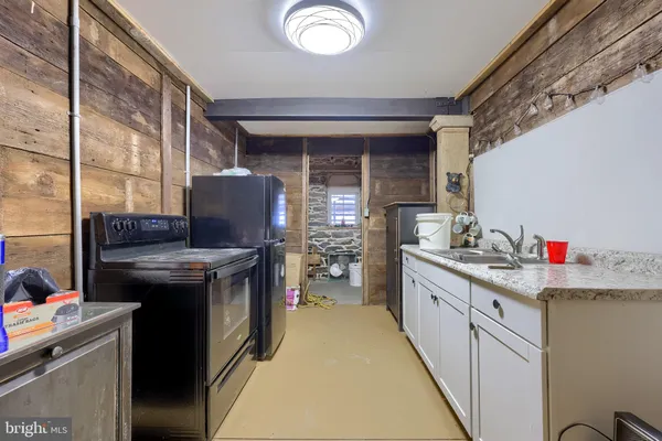 a kitchen with a stove and a sink