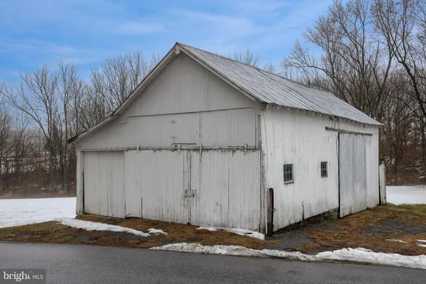 a view of a house with a street