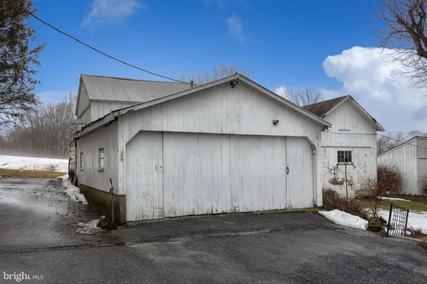 a view of a house with a yard and garage