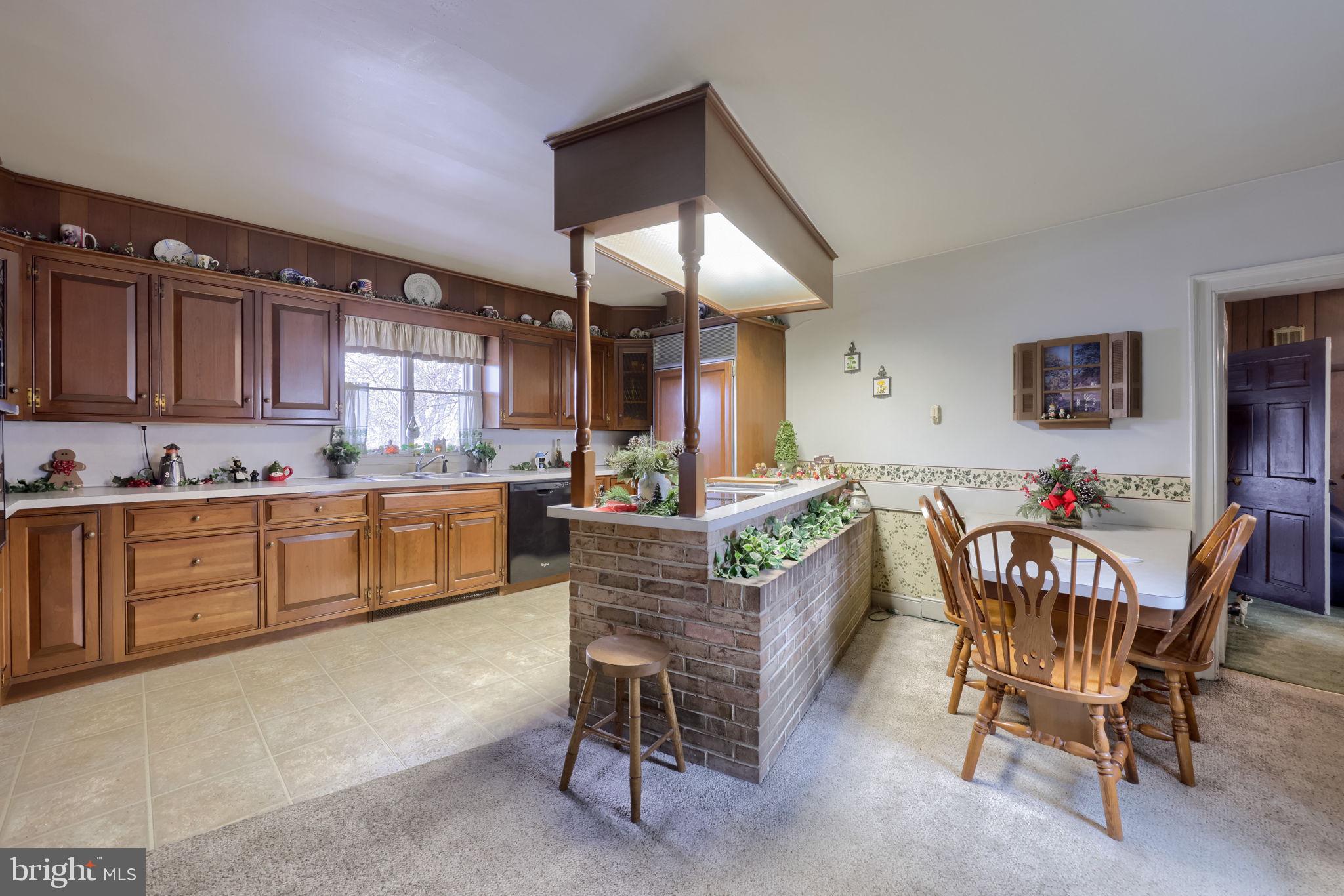 430 Stehman Road Lancaster, PA 17603 - Photo 10 of 43 a living room with stainless steel appliances kitchen island granite countertop furniture and a kitchen view