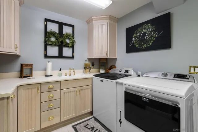 a spacious bedroom with a bed couch and window