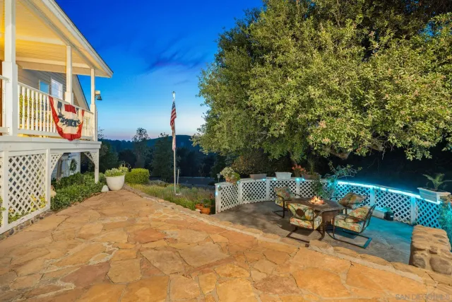 a room with furniture a rug and a table