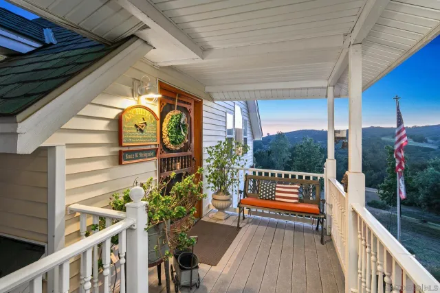 a view of a chairs and table in the back yard