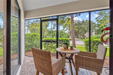 a dining room with furniture and a window