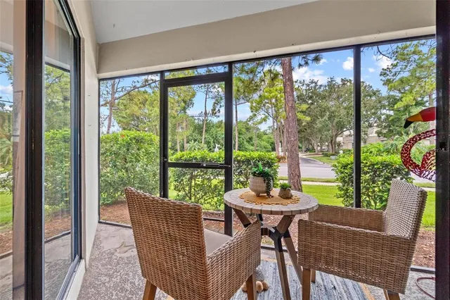 a dining room with furniture and a window