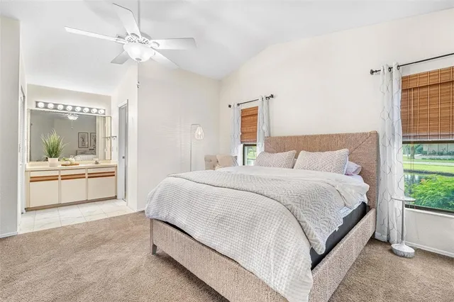 a bedroom with a bed and a table in it