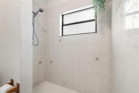 a white toilet sitting next to a bath tub