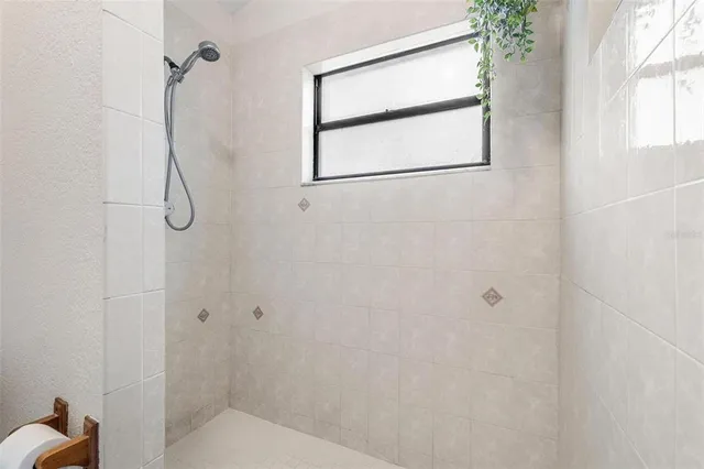 a white toilet sitting next to a bath tub