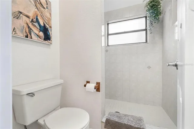 a front view of a house with plants