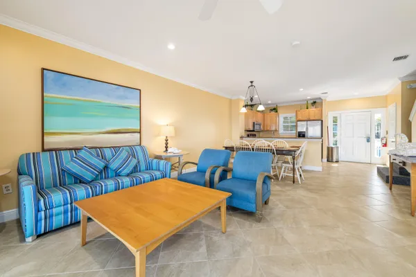 a kitchen with stainless steel appliances granite countertop a refrigerator a stove top oven a sink and dishwasher