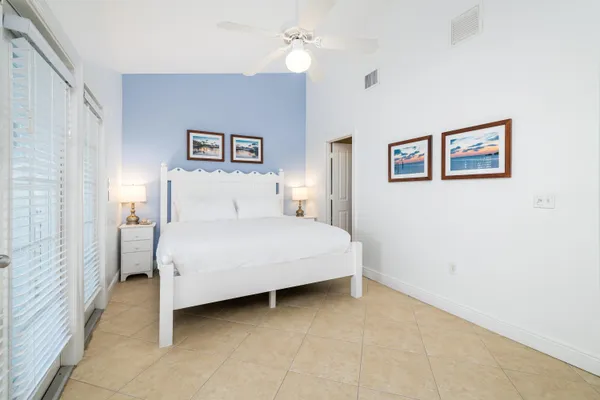 a bedroom with bed and a night stand