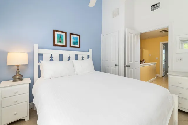 a bathroom with a granite countertop sink toilet and a mirror