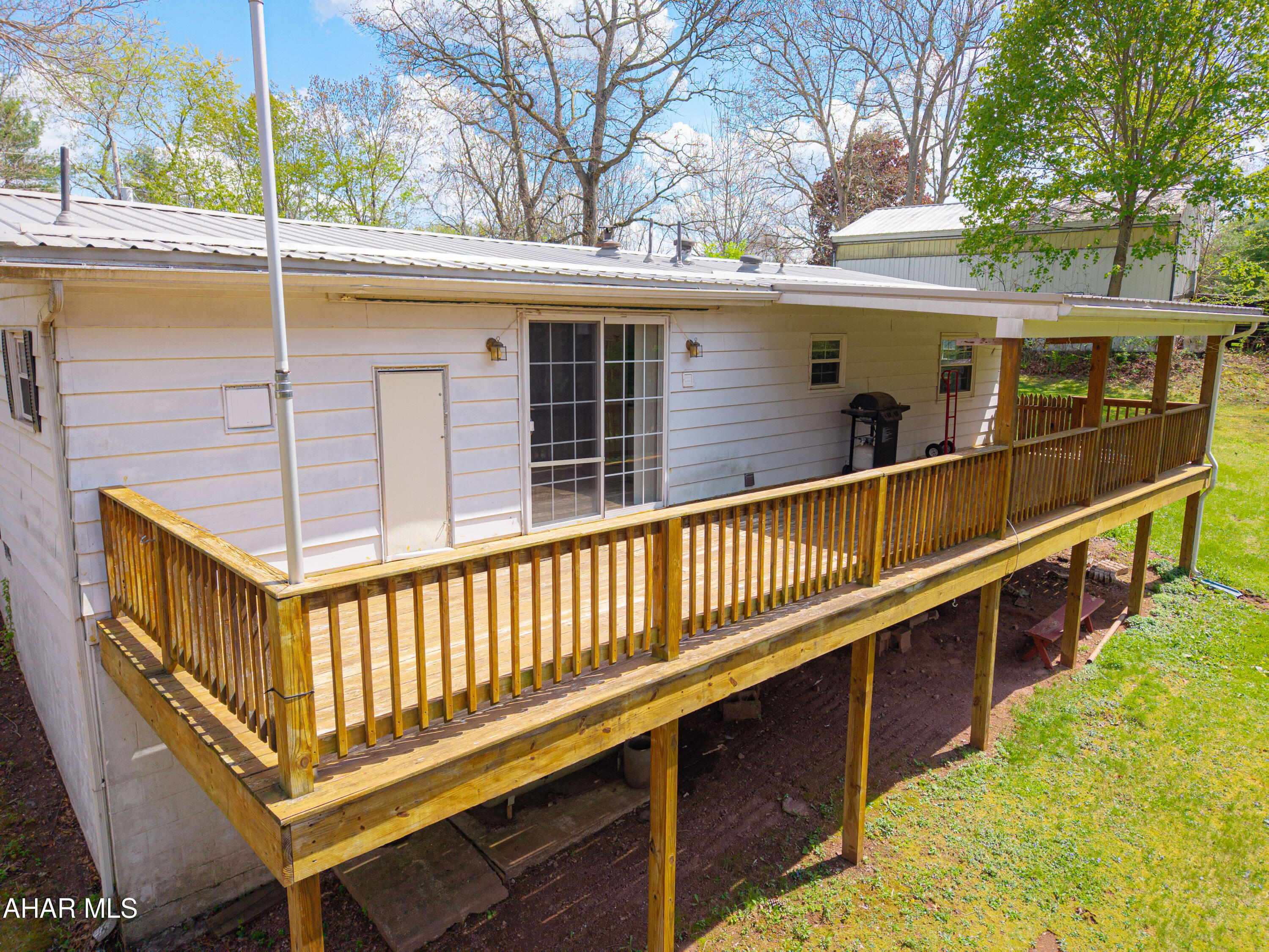 151 Pine Echo Road Everett, PA 15537 - Photo 11 of 51 a view of a balcony with car parked