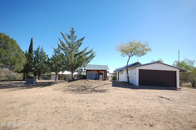 a house with a yard and a garage