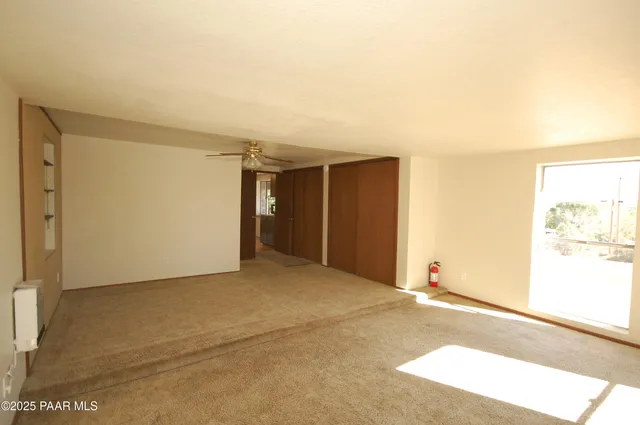 a view of an empty room and window