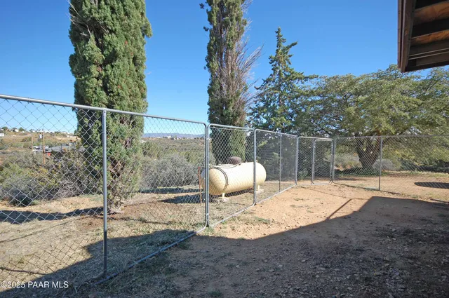 a view of a yard covered in snow