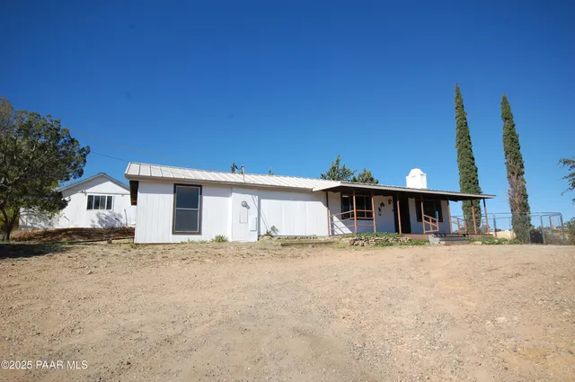 a view of a city with tall trees