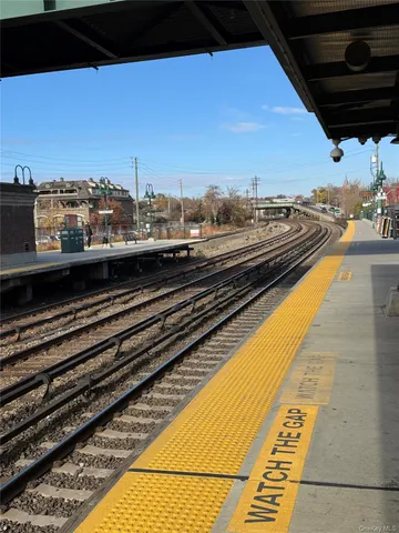 a front view of a house with a street