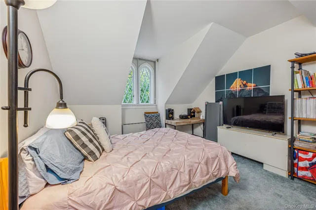 a view of a room with furniture and fan