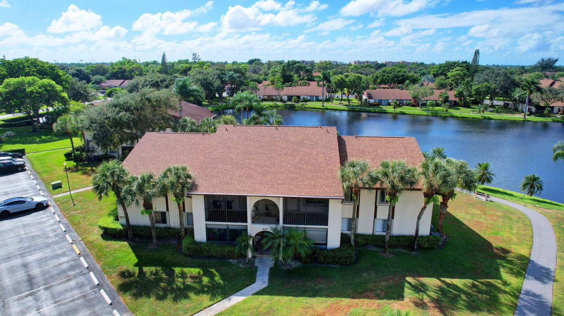 an aerial view of a house with swimming pool patio and outdoor seating