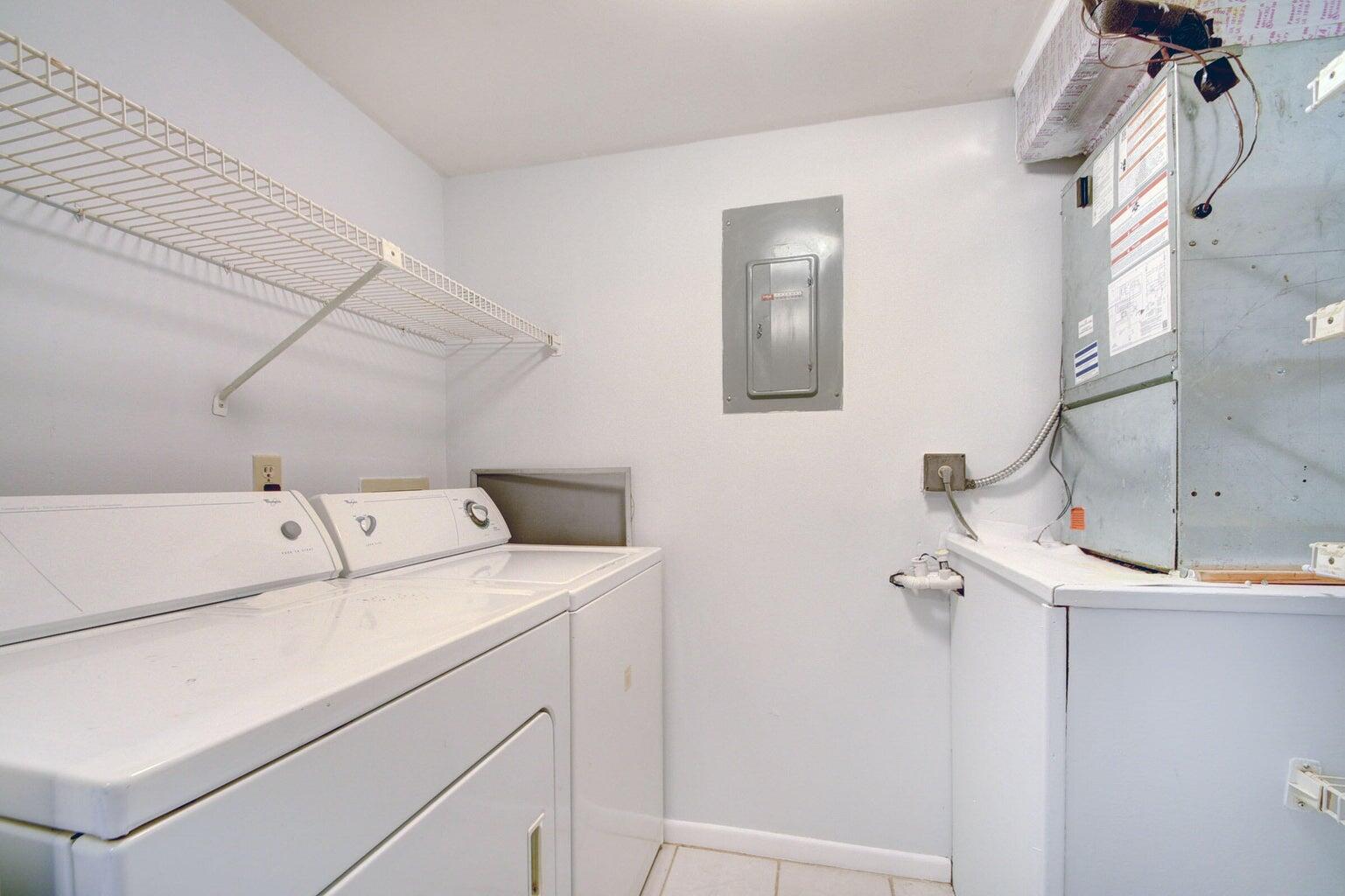4844 Sable Pine Circle, Unit D2 West Palm Beach, FL 33417 - Photo 17 of 45 a utility room with dryer and washer