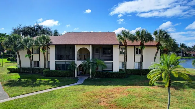 a front view of house and yard with green space