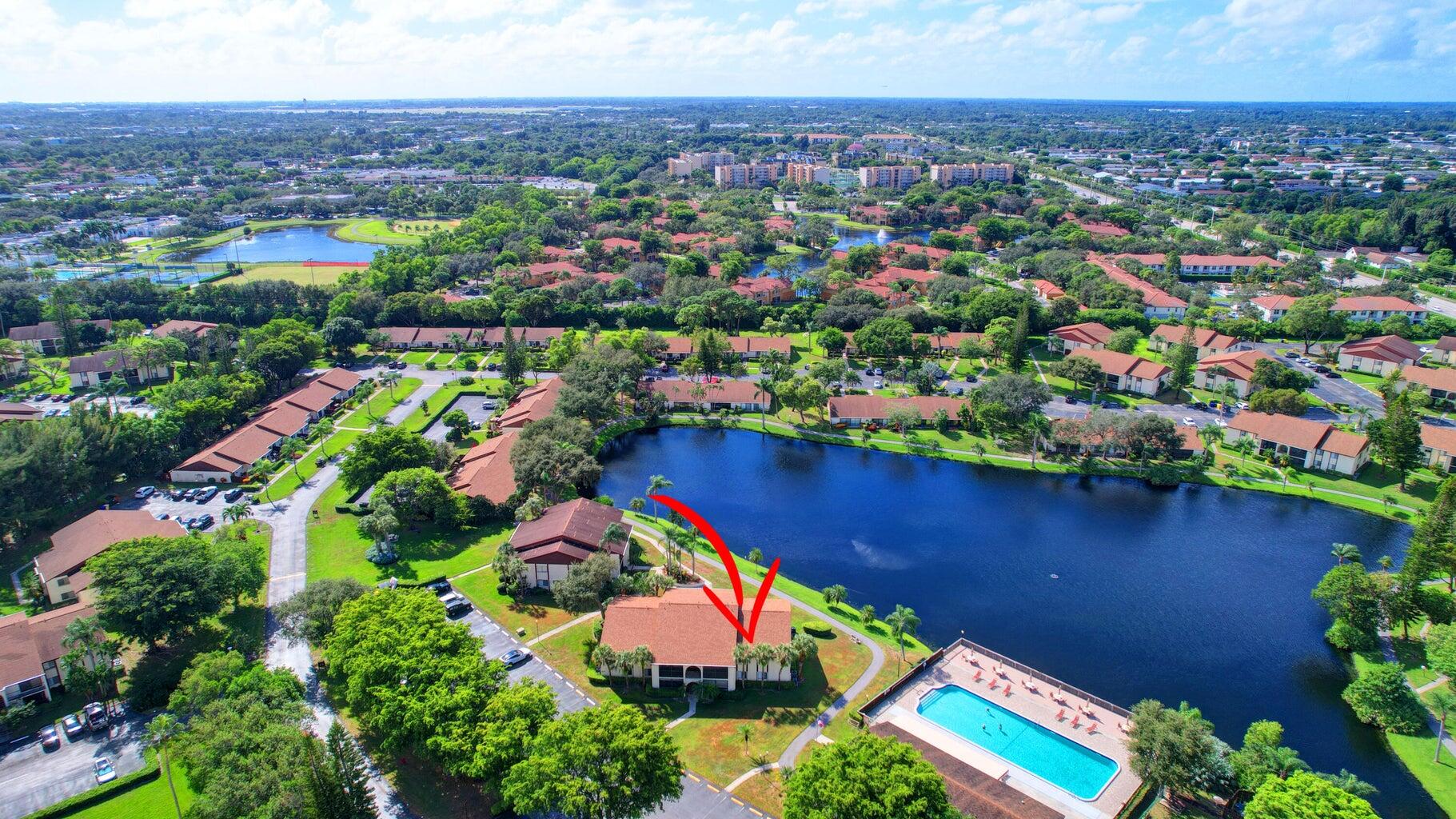 4844 Sable Pine Circle, Unit D2 West Palm Beach, FL 33417 - Photo 31 of 45 an aerial view of residential houses with outdoor space and lake view
