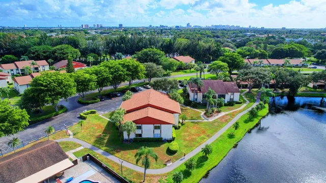 a view of a house with a yard and a patio