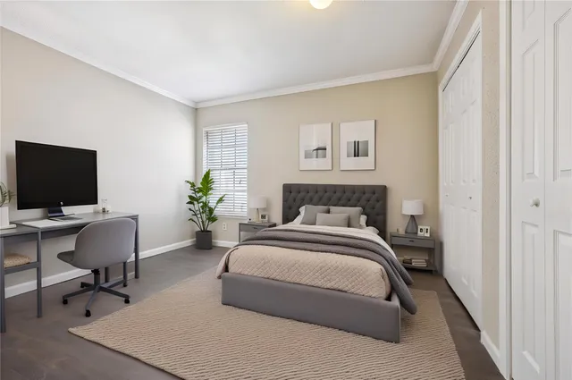 a bedroom with a workspace