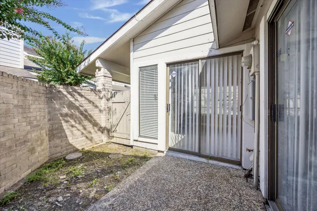 a view of a porch with backyard of house