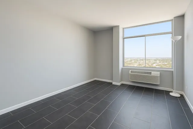 a view of an empty room with a window