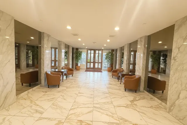 a lobby with furniture and a table in it