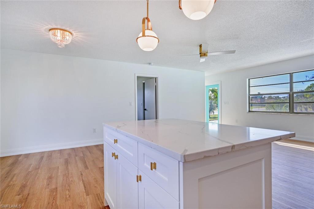 4666 Dorando Drive Naples, FL 34103 - Photo 11 of 30 a view of kitchen with granite countertop window