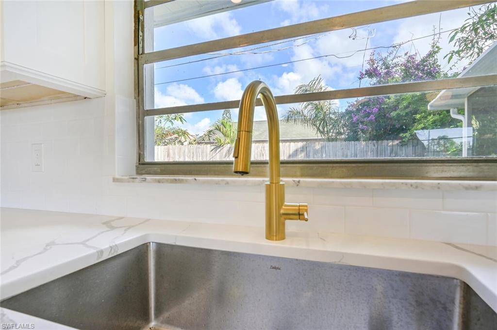 4666 Dorando Drive Naples, FL 34103 - Photo 12 of 30 a view of a bathroom with a tub and window