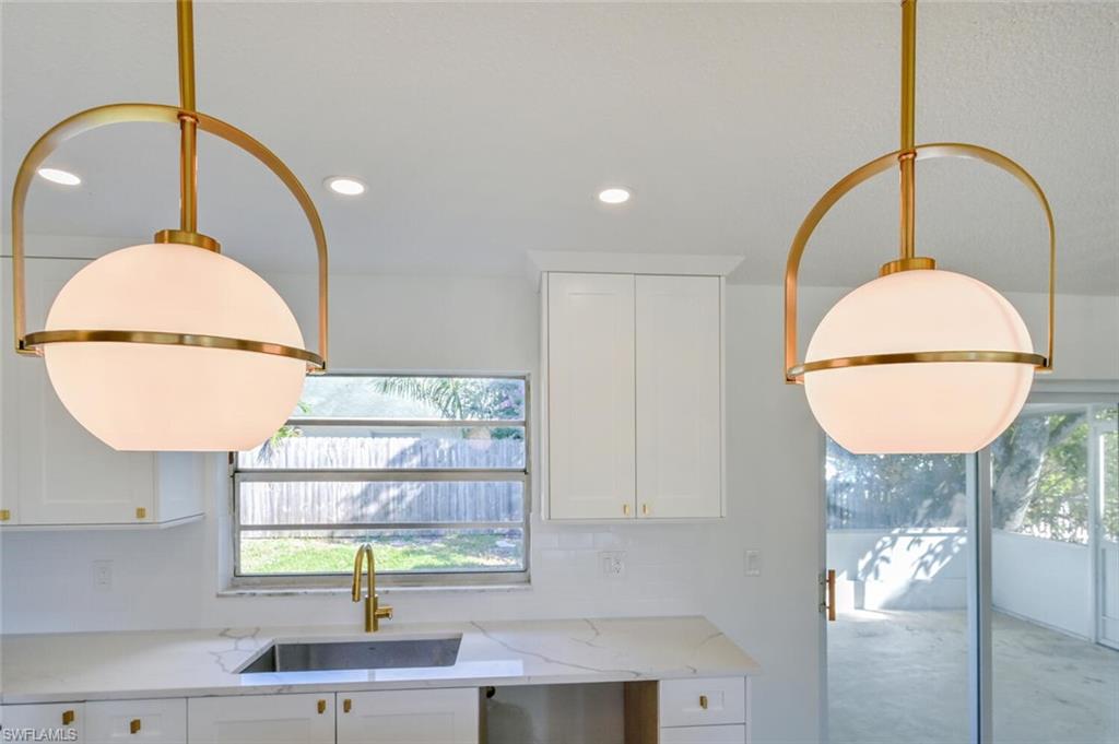 4666 Dorando Drive Naples, FL 34103 - Photo 13 of 30 a bathroom with a sink and mirror