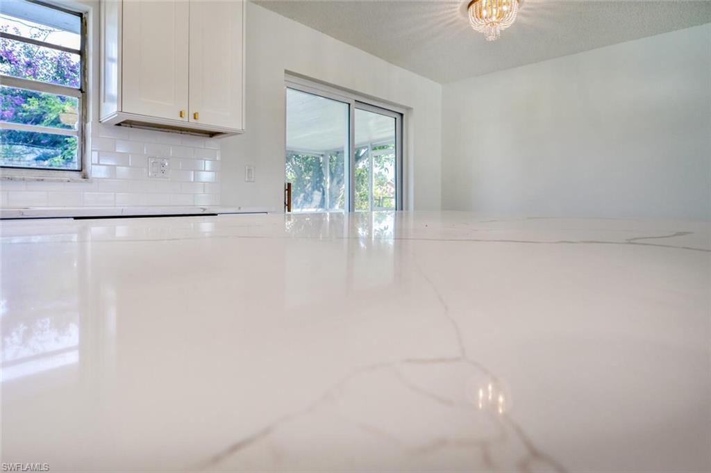 4666 Dorando Drive Naples, FL 34103 - Photo 14 of 30 a view of an empty room with a window