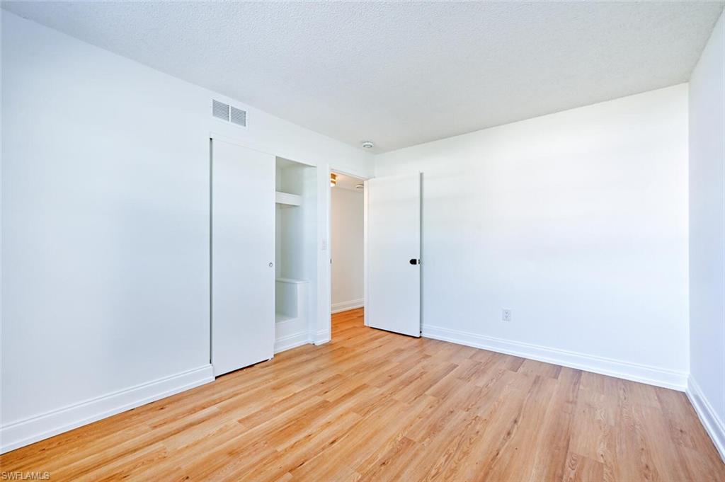 4666 Dorando Drive Naples, FL 34103 - Photo 20 of 30 a view of empty room with wooden floor