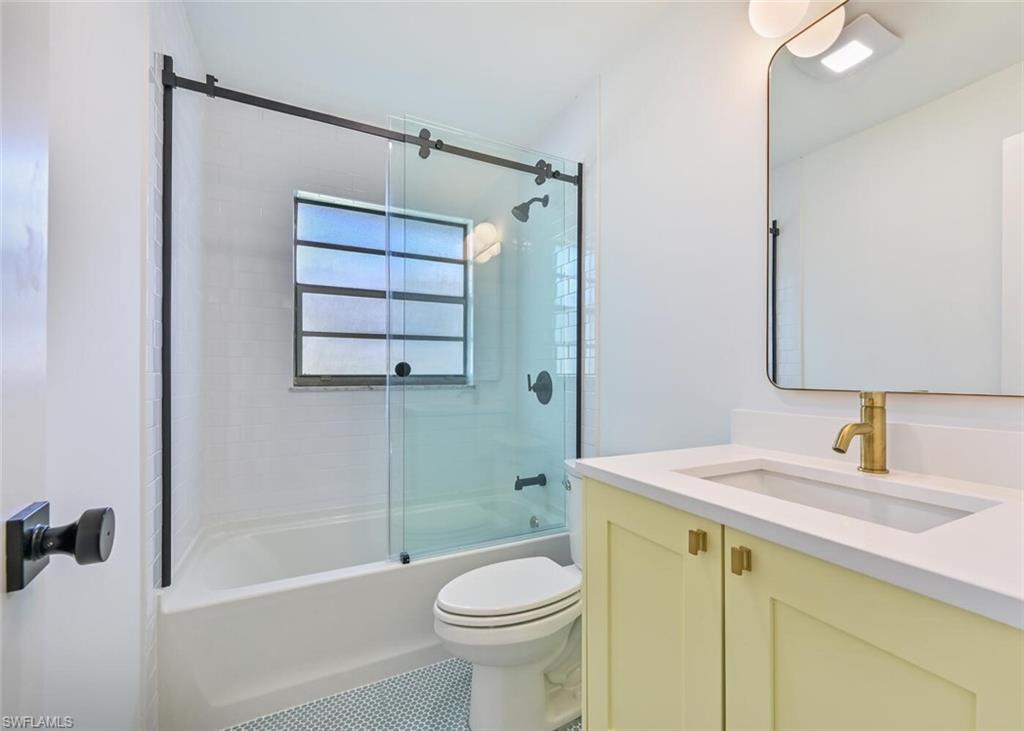 4666 Dorando Drive Naples, FL 34103 - Photo 21 of 30 a bathroom with a sink a toilet and shower