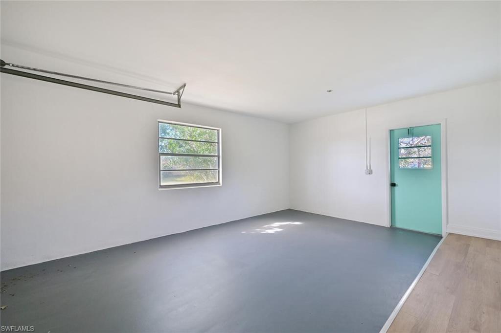 4666 Dorando Drive Naples, FL 34103 - Photo 25 of 30 an empty room with windows