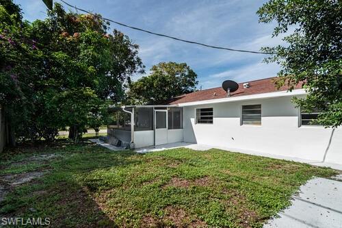 4666 Dorando Drive Naples, FL 34103 - Photo 30 of 30 a view of a house with a yard