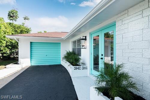 4666 Dorando Drive Naples, FL 34103 - Photo 3 of 30 a view of a house with a yard