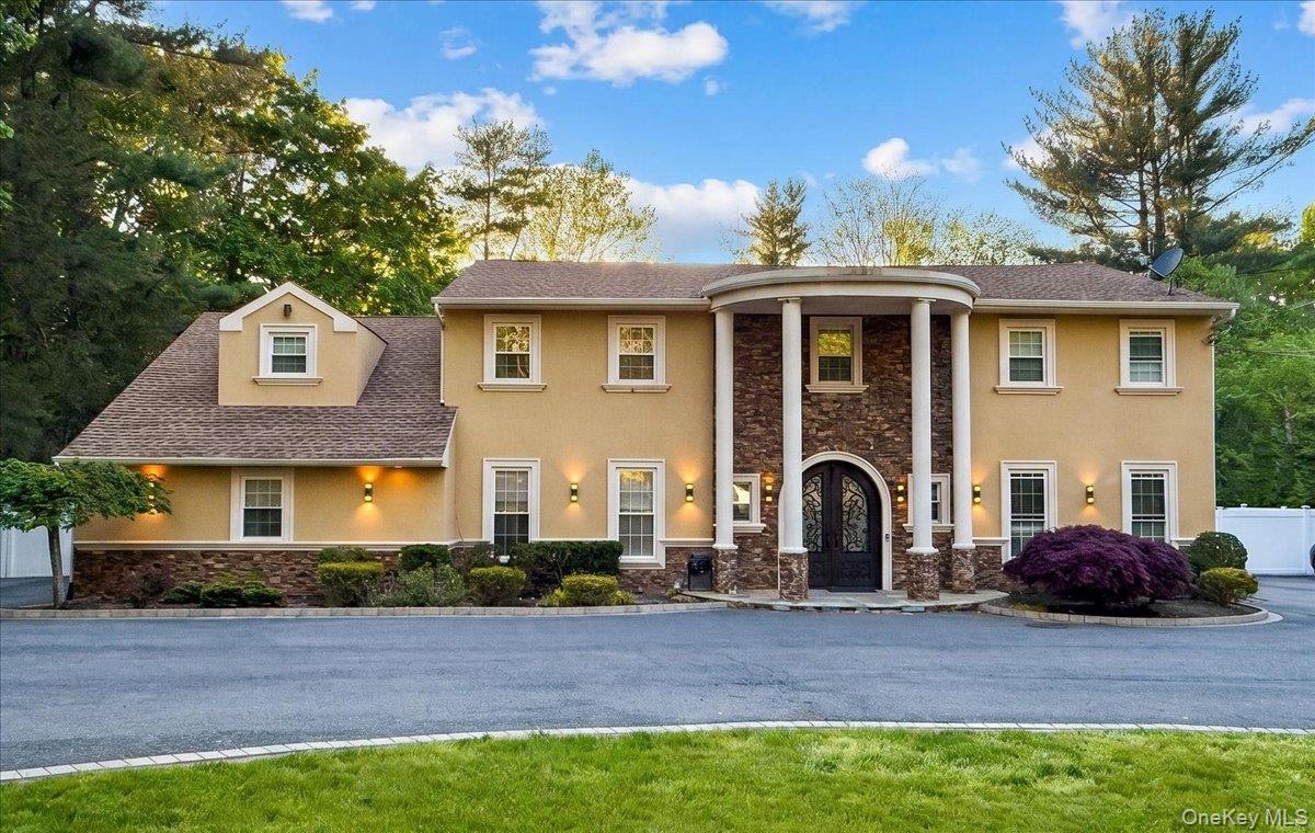626 Caledonia Road Dix Hills, NY 11746 - Photo 2 of 49 a front view of a house with garden