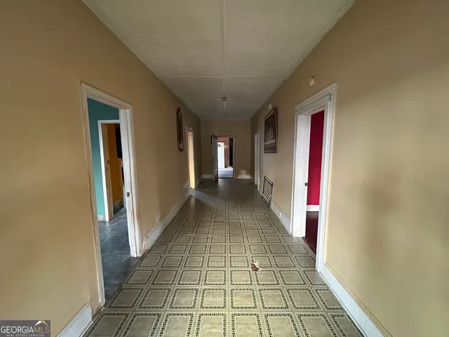 a view of hallway with a window and a mirror