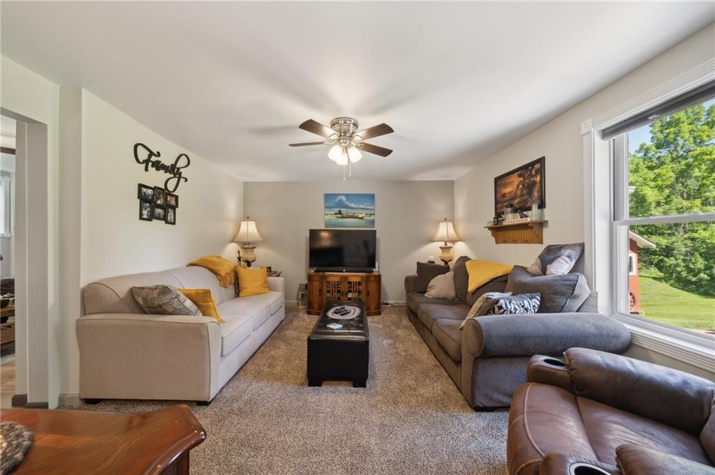 735 Leighty Hollow Road Ruffs Dale, PA 15679 - Photo 8 of 40 a living room with furniture and a large window