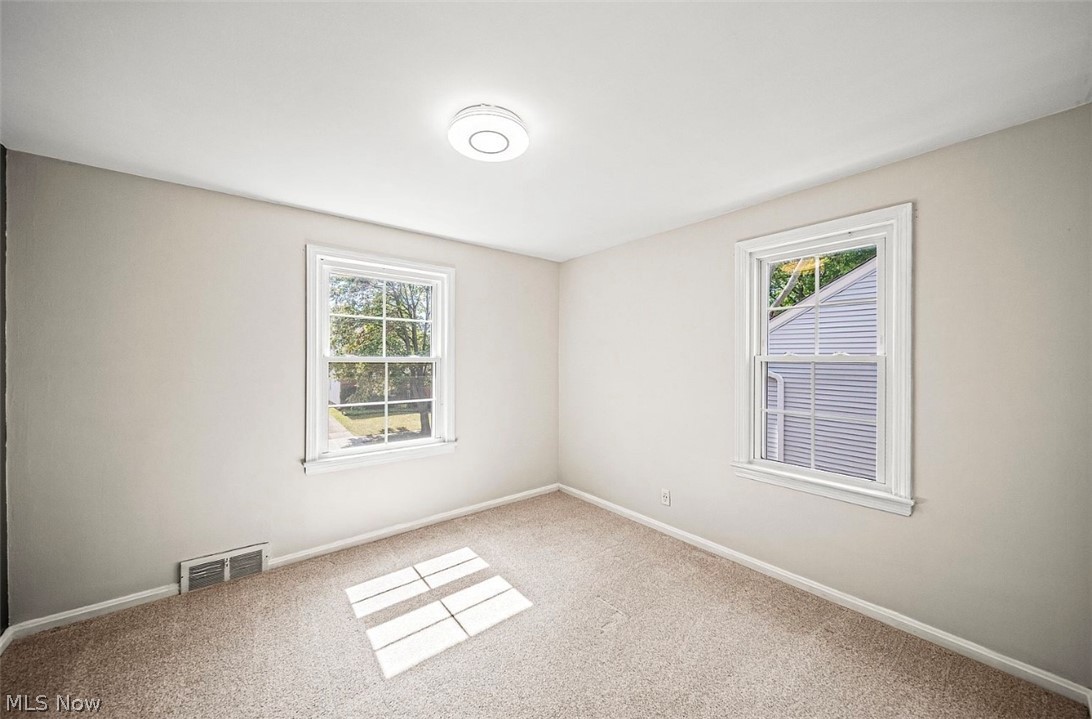 4069 Bushnell Road Cleveland, OH 44121 - Photo 22 of 39 Unfurnished room featuring light colored carpet