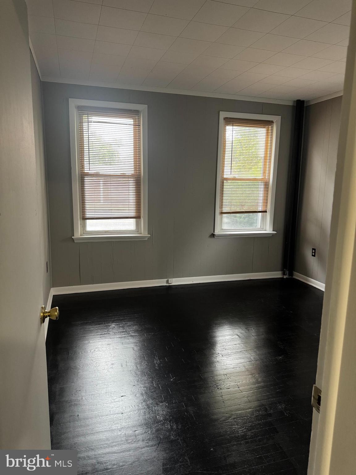 331 West Front Street, Unit 2 Florence, NJ 08518 - Photo 11 of 13 a view of an empty room with wooden floor and a window