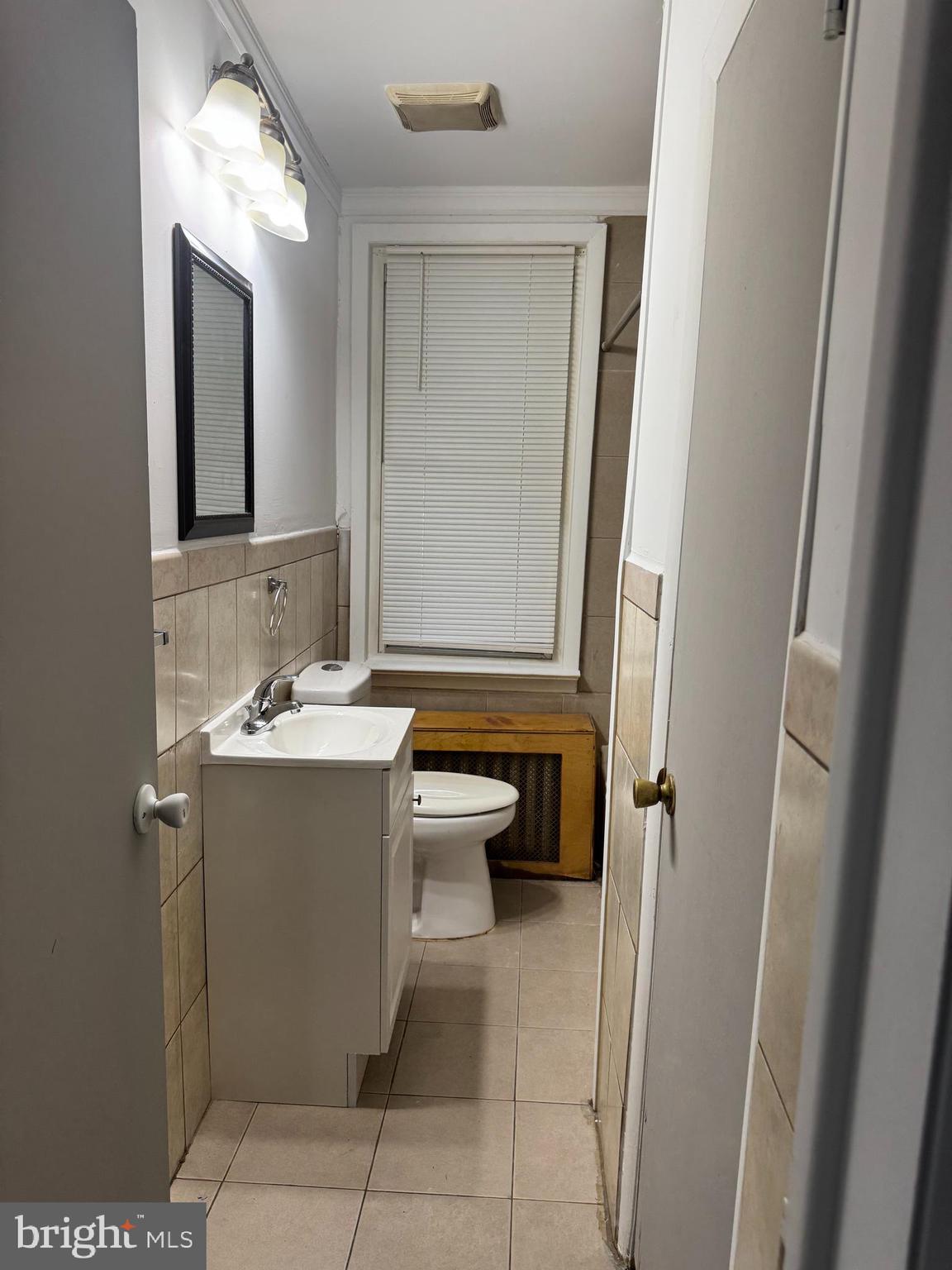 331 West Front Street, Unit 2 Florence, NJ 08518 - Photo 12 of 13 a bathroom with a sink and mirror with toilet