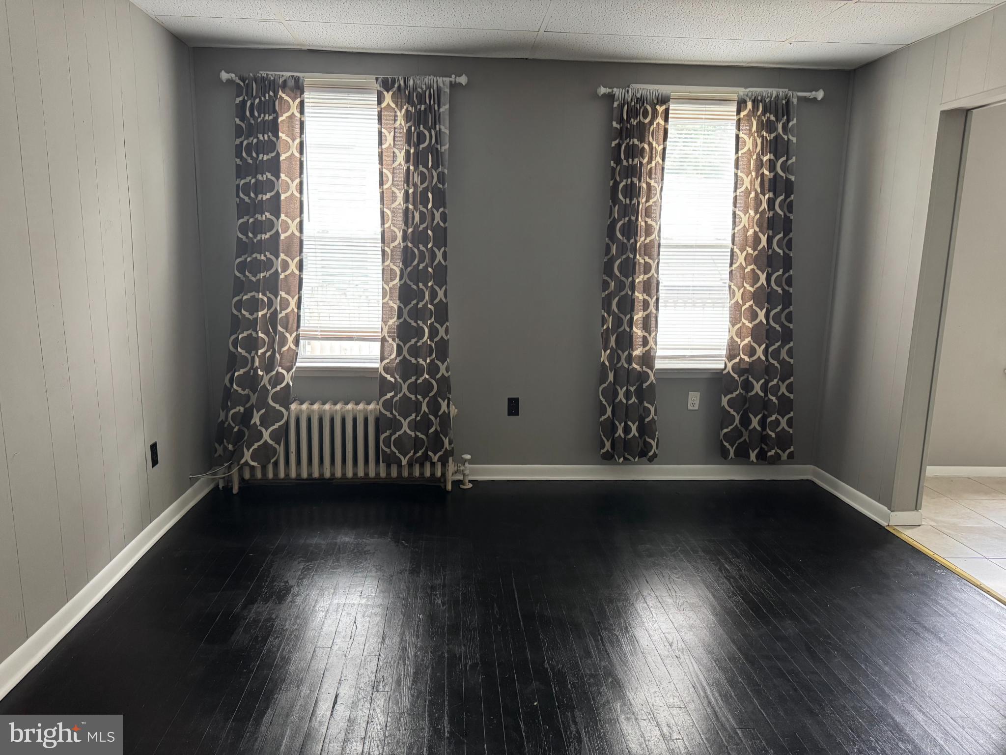 331 West Front Street, Unit 2 Florence, NJ 08518 - Photo 3 of 13 an empty room with wooden floor and windows