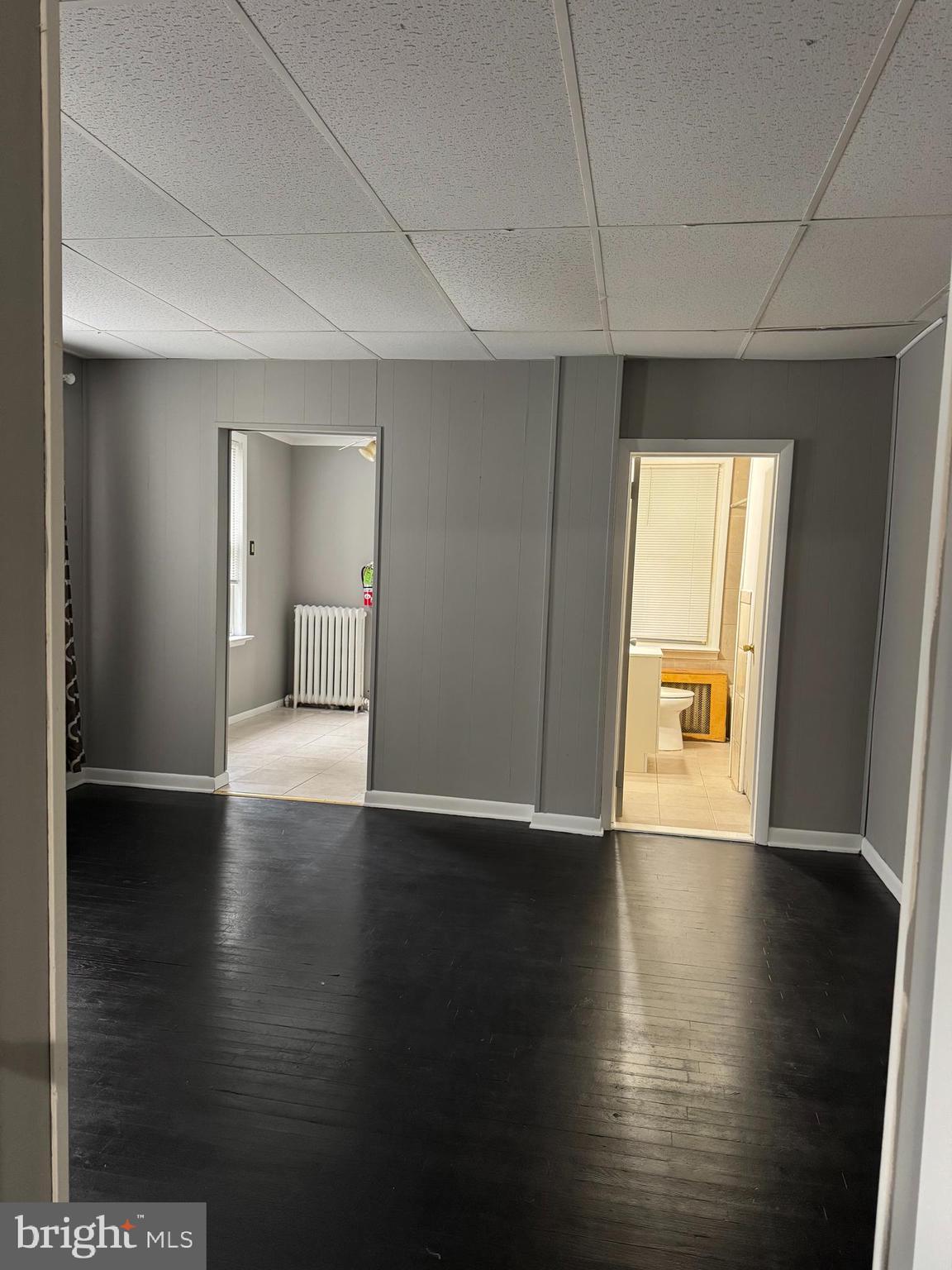 331 West Front Street, Unit 2 Florence, NJ 08518 - Photo 5 of 13 a view of an empty room with wooden floor and a window